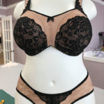 Matching beige bra and panties with black lace accents